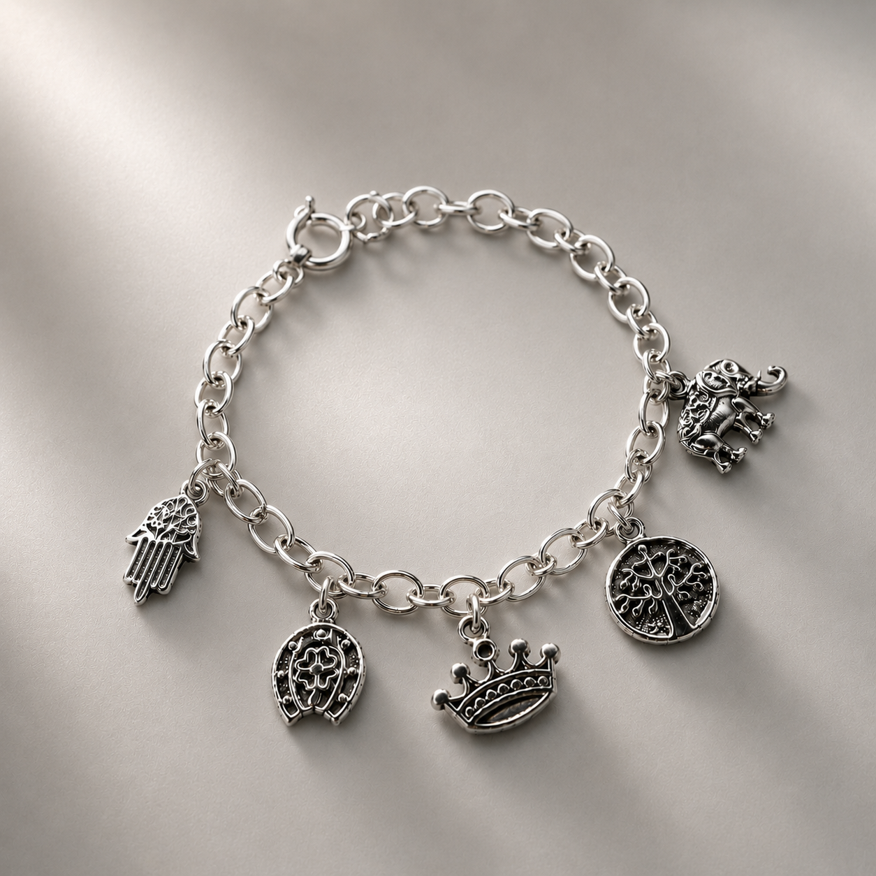 Pulsera de plata 925 con charms de árbol de la vida, corona, elefante, herradura, trebol y mano de Fátima